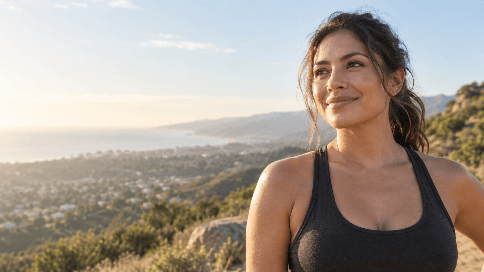 Adult woman pausing during an ordinary outdoor fitness routine