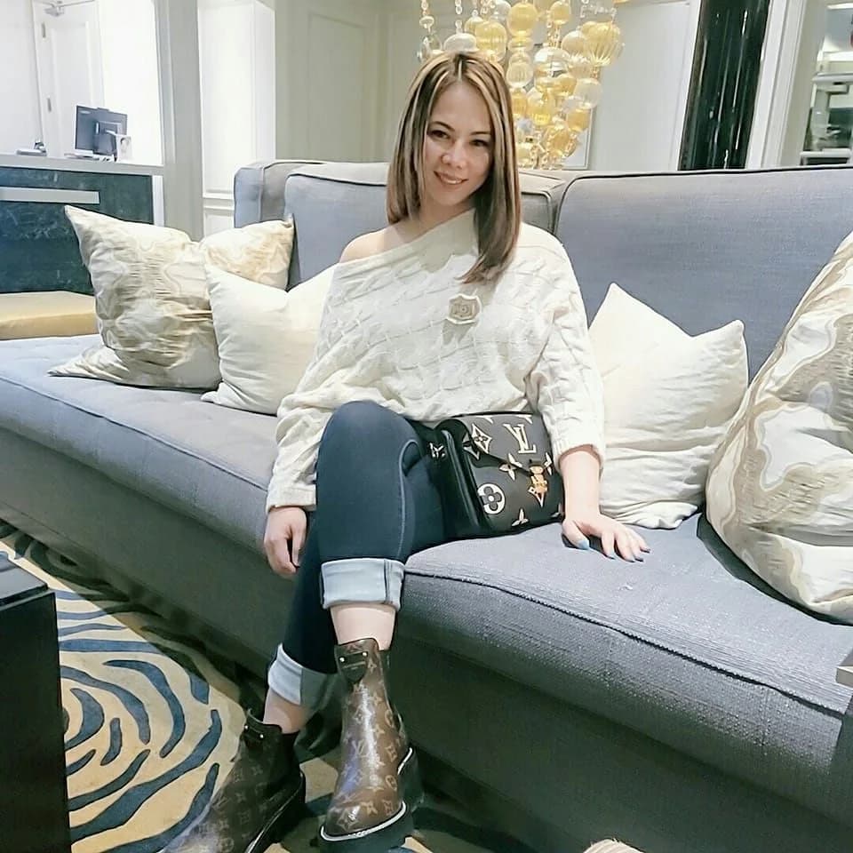 Drip RevIVe founder Levaneigh Rodriguez seated on a sofa